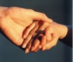 One hand holding and helping another