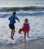 Kids Jumping in the Waves