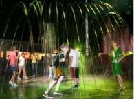 Teens Running in Water Fountain